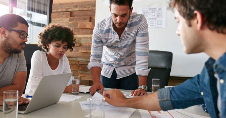 people working together at a conference table