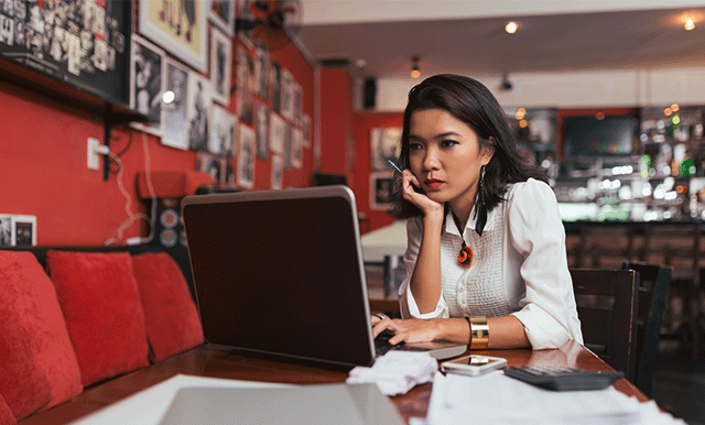 woman looking at a laptop